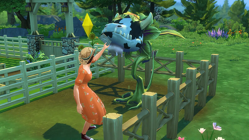 A Sim lovingly tends to her Cowplant, satisfying its hunger in a vibrant garden teeming with blooming flowers and abundant greenery.